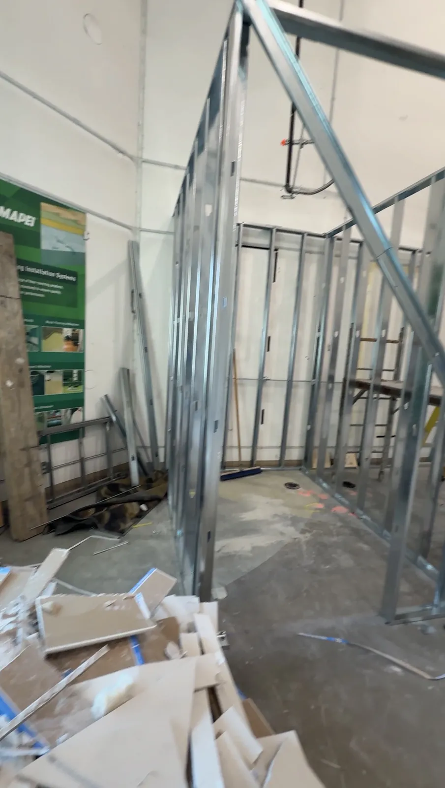 Interior demolition and metal framing during the MAPEI commercial renovation in Delta, BC.